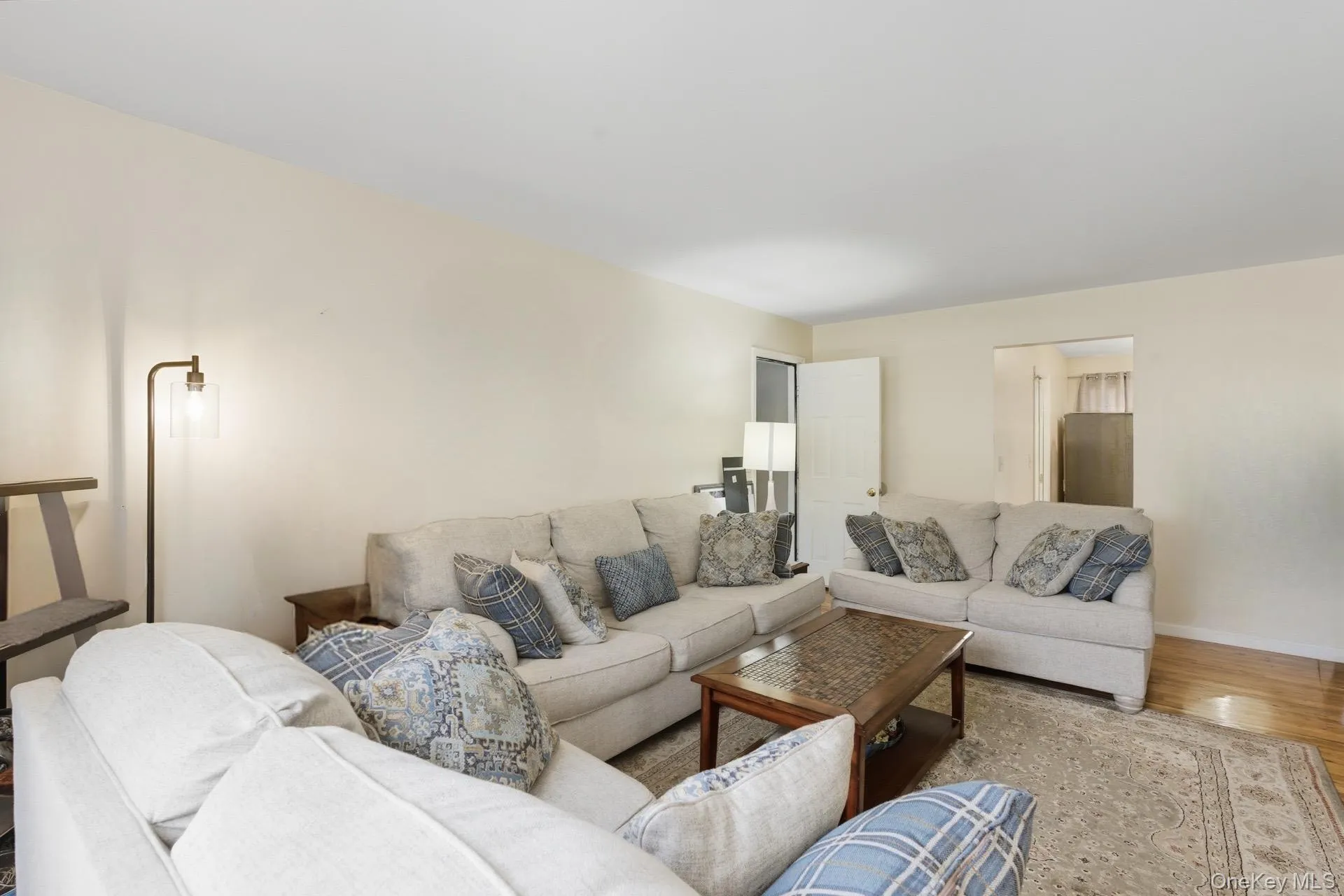 Living room featuring wood finished floors and baseboards Living room featuring wood finished floors and baseboards