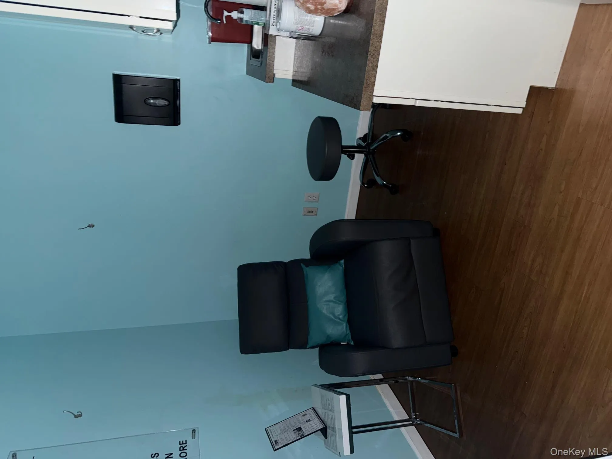 Sitting room with dark wood-style flooring Sitting room with dark wood-style flooring