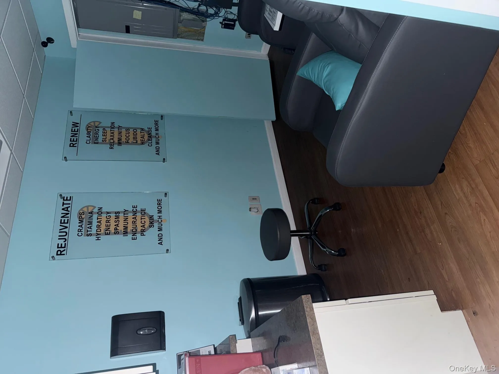 Office featuring a paneled ceiling, dark wood-type flooring, and electric panel Office featuring a paneled ceiling, dark wood-type flooring, and electric panel