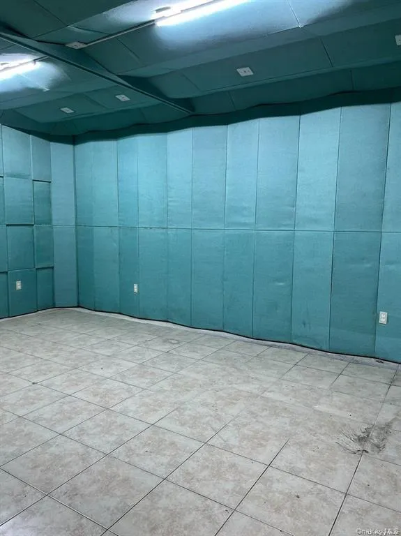 Empty room featuring light tile patterned floors Empty room featuring light tile patterned floors