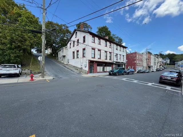 View of the entire corner where the subject building is located. View of the entire corner where the subject building is located.