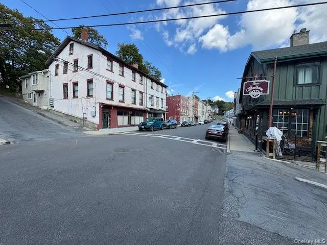 View of the front of the subject building the road and sidewalks... View of the front of the subject building the road and sidewalks...