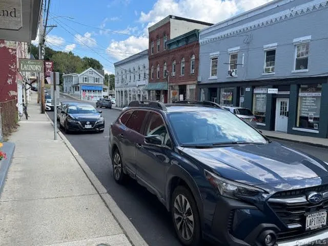 View of the street in front of the subject space with sidewalks and other stores... View of the street in front of the subject space with sidewalks and other stores...