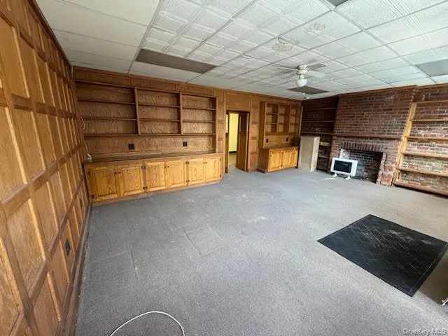 Interior of the main space with built-in wall shelving... Interior of the main space with built-in wall shelving...