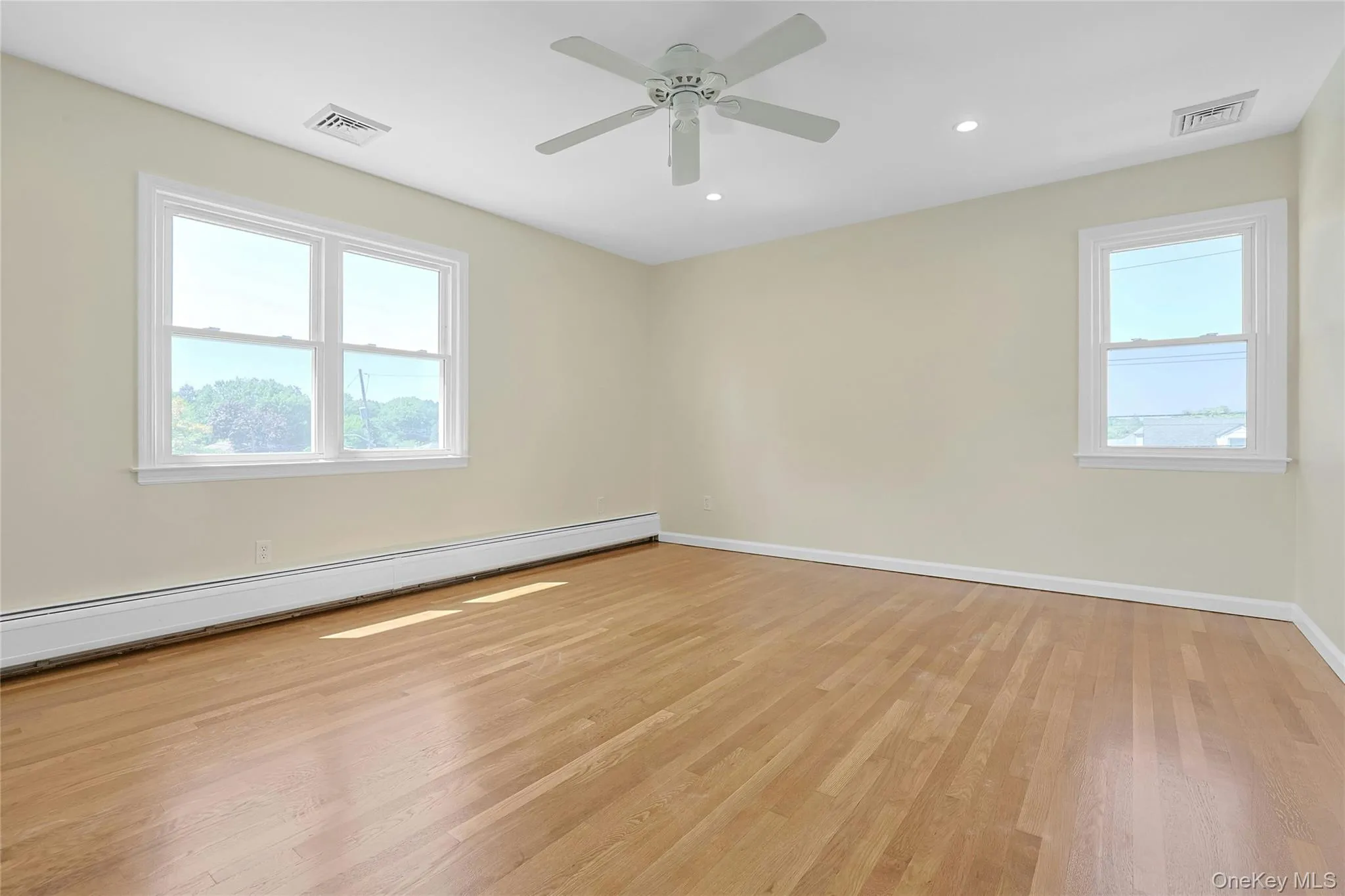 Primary bedroom with ceiling fan, hardwood floors Primary bedroom with ceiling fan, hardwood floors