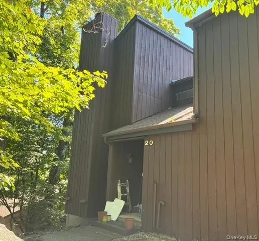 View of side of home featuring a chimney View of side of home featuring a chimney
