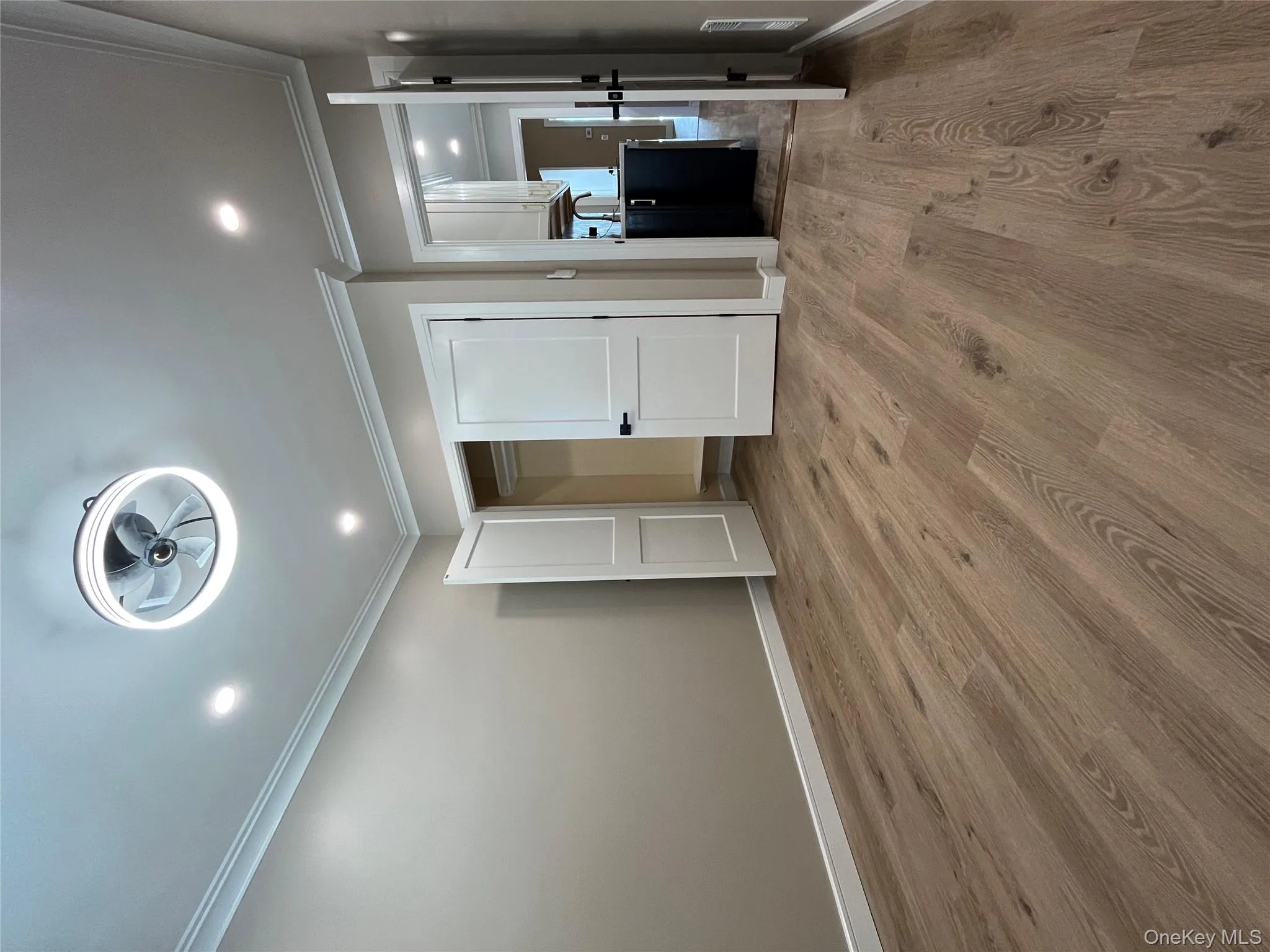 Unfurnished bedroom with ornamental molding, light wood finished floors, recessed lighting, and a closet Unfurnished bedroom with ornamental molding, light wood finished floors, recessed lighting, and a closet