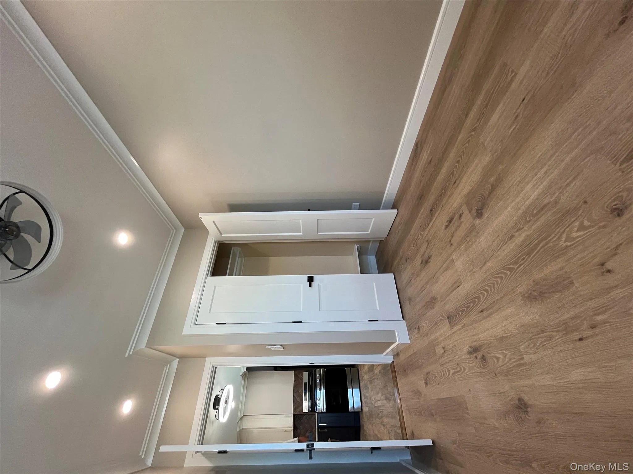 Unfurnished bedroom featuring crown molding, wood finished floors, a closet, and recessed lighting Unfurnished bedroom featuring crown molding, wood finished floors, a closet, and recessed lighting