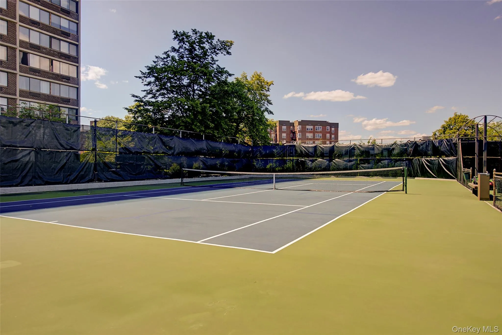View of tennis court with community basketball court View of tennis court with community basketball court