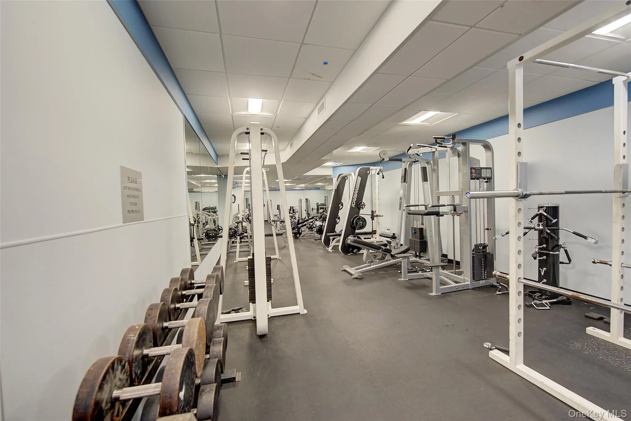 Gym with a paneled ceiling Gym with a paneled ceiling