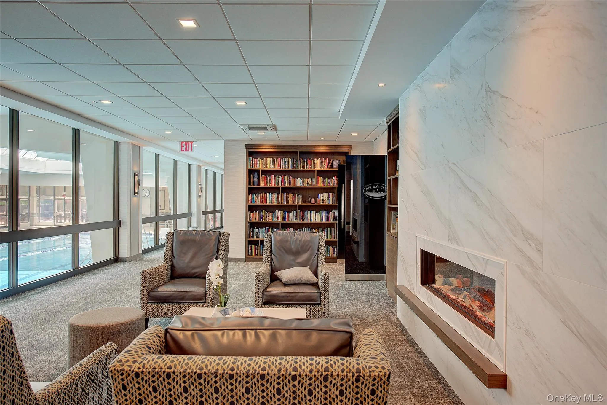 Living area featuring recessed lighting and a premium fireplace Living area featuring recessed lighting and a premium fireplace