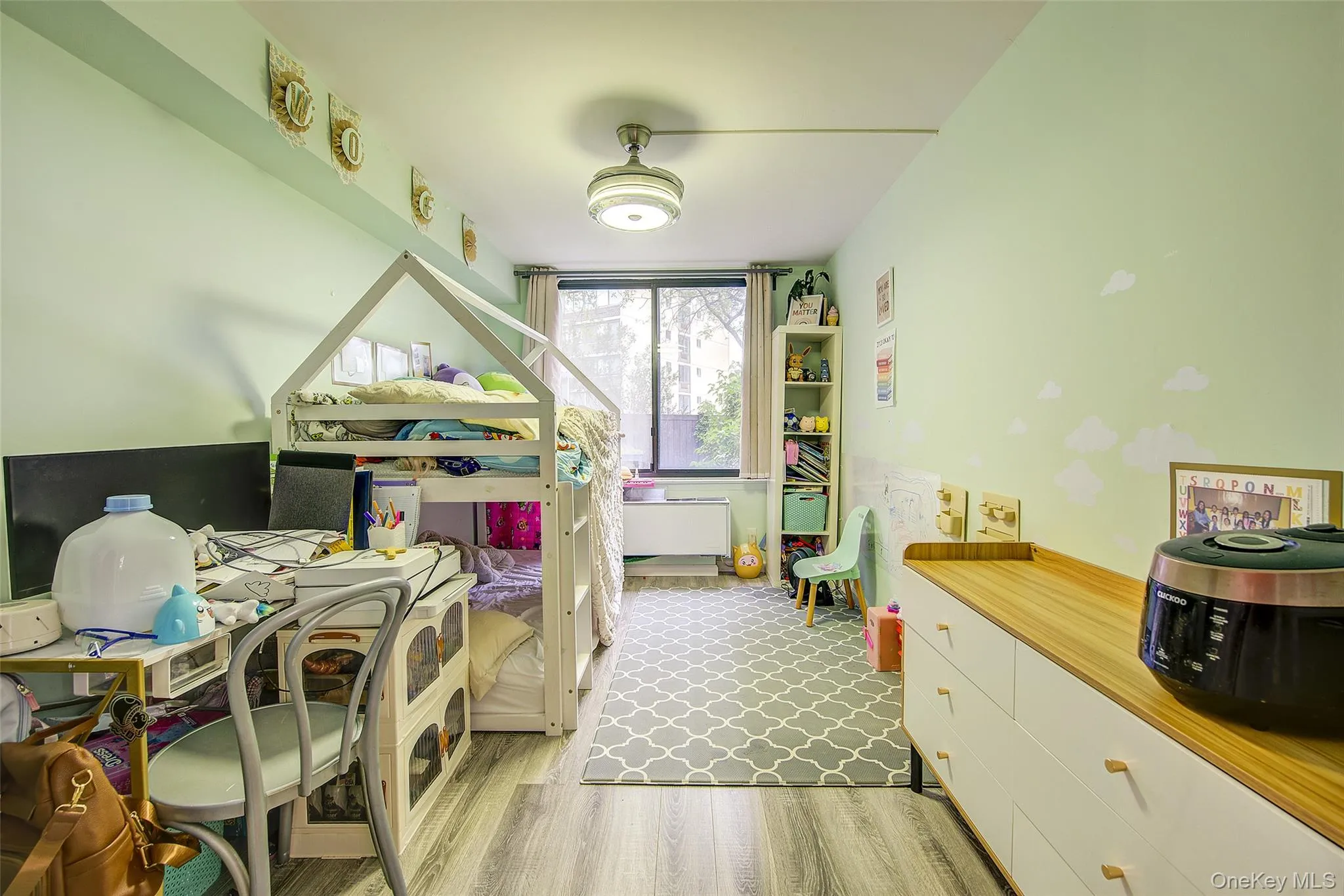 Bedroom with light wood-style flooring Bedroom with light wood-style flooring