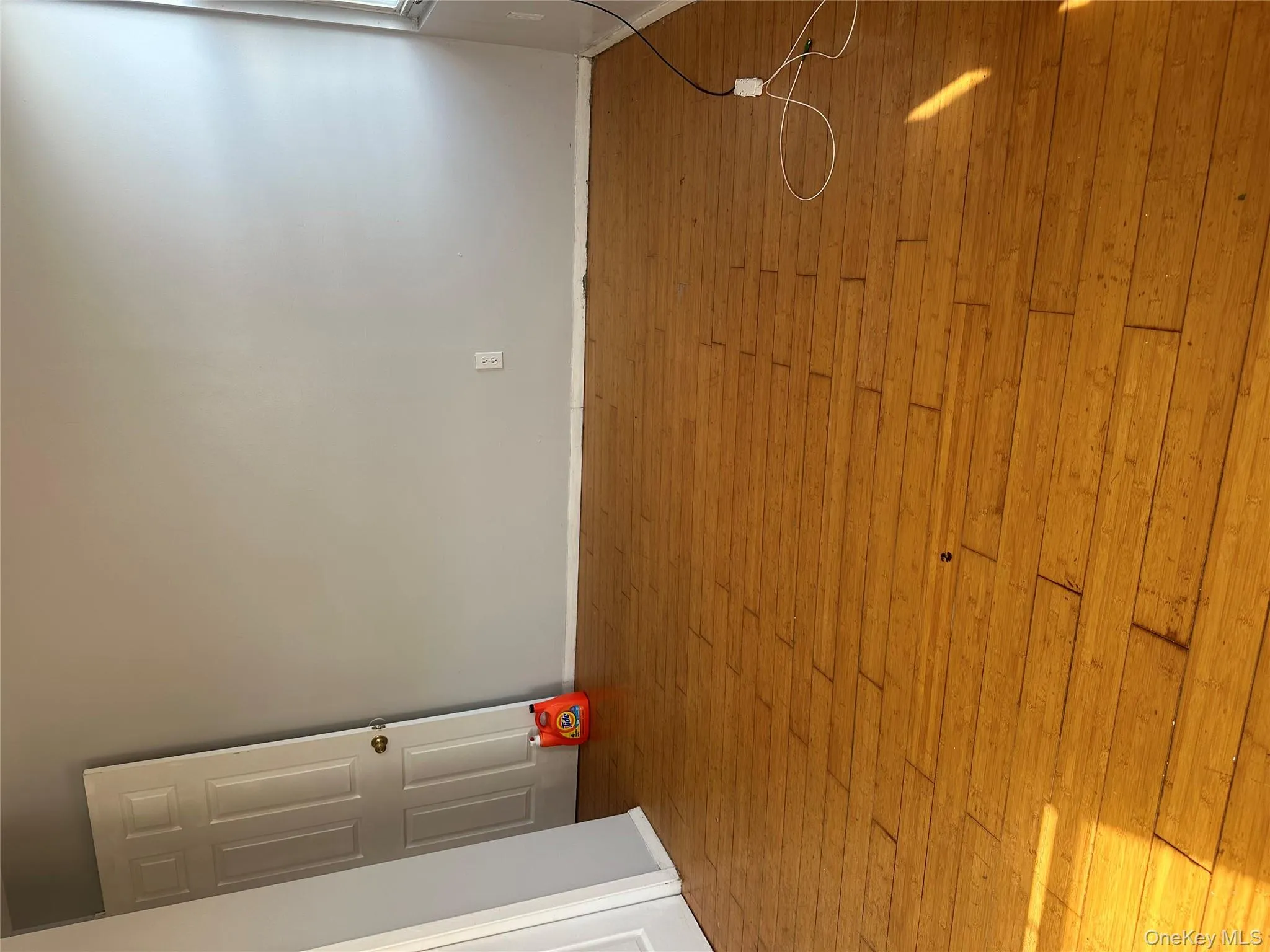 Unfurnished room featuring baseboards and wood-type flooring Unfurnished room featuring baseboards and wood-type flooring
