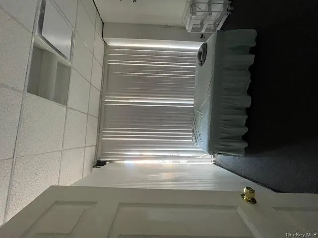 Carpeted bedroom with a paneled ceiling and billiards Carpeted bedroom with a paneled ceiling and billiards