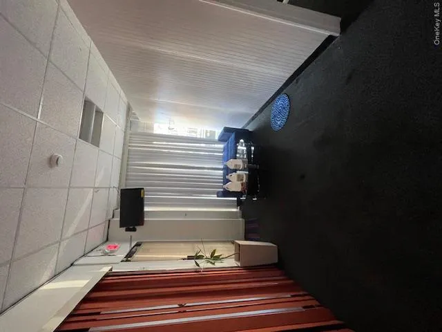 Common area with a drop ceiling Common area with a drop ceiling