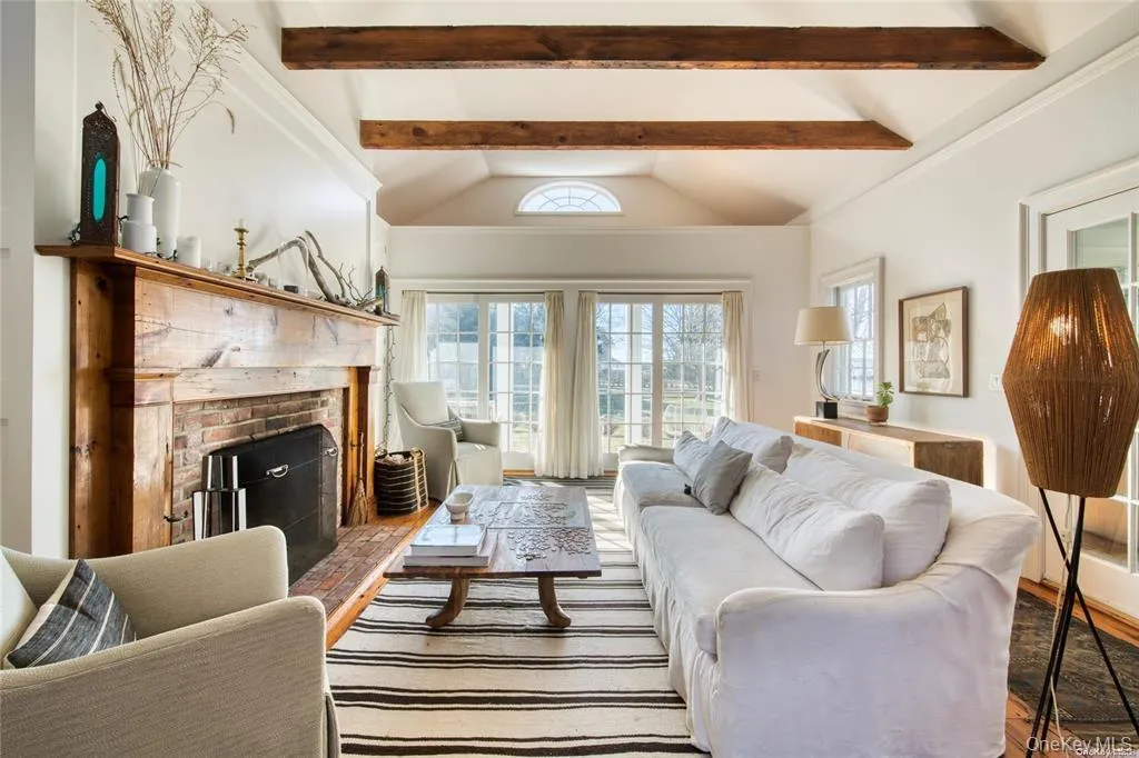 Living room with a brick fireplace Living room with a brick fireplace