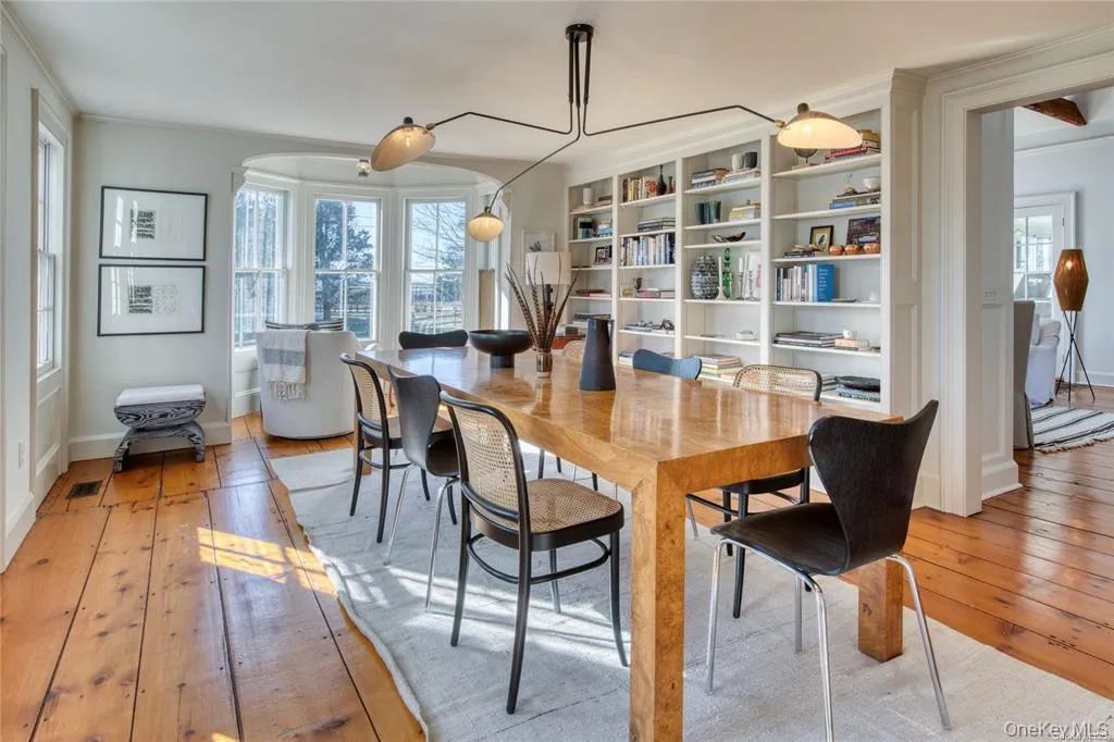 Dining room with light wood-type flooring Dining room with light wood-type flooring