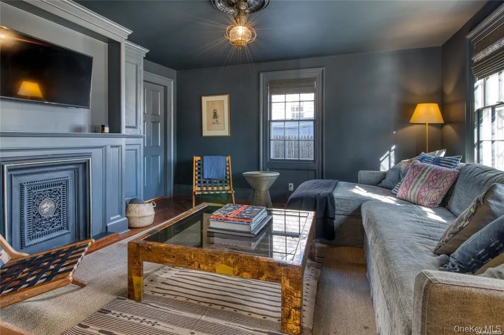 Living room featuring healthy amount of natural light and a fireplace Living room featuring healthy amount of natural light and a fireplace