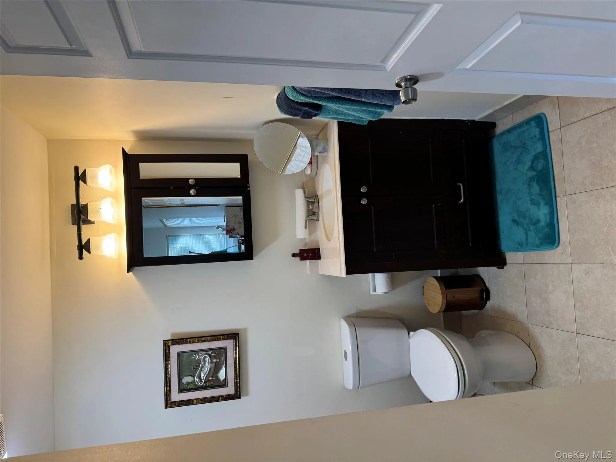 Bathroom featuring vanity and light tile patterned floors Bathroom featuring vanity and light tile patterned floors