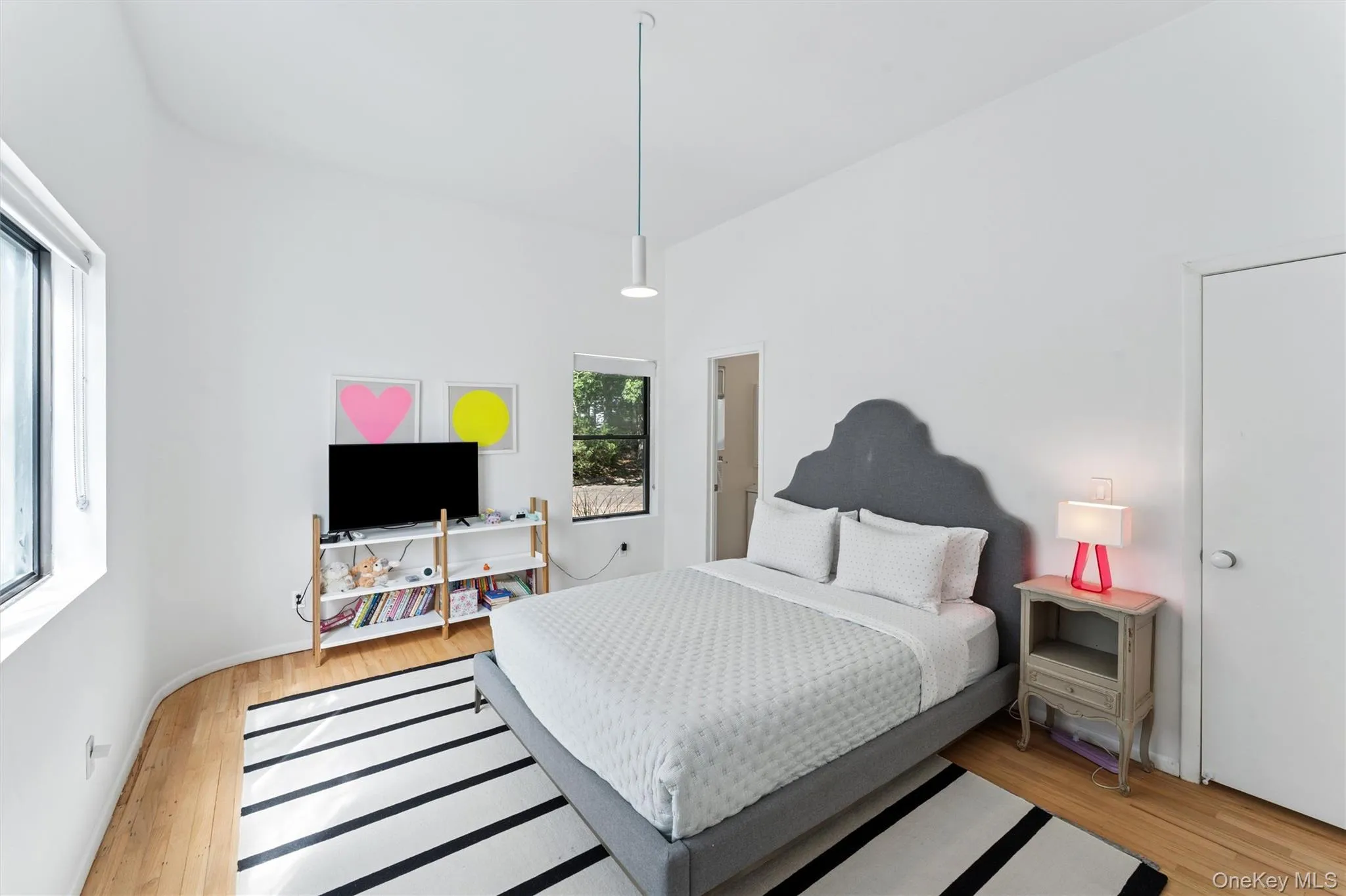 Bedroom with light wood finished floors Bedroom with light wood finished floors