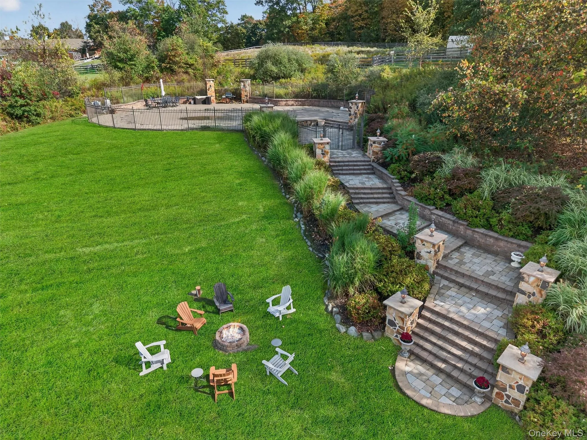Gorgeous paver staircase to the pool and patio. Gorgeous paver staircase to the pool and patio.