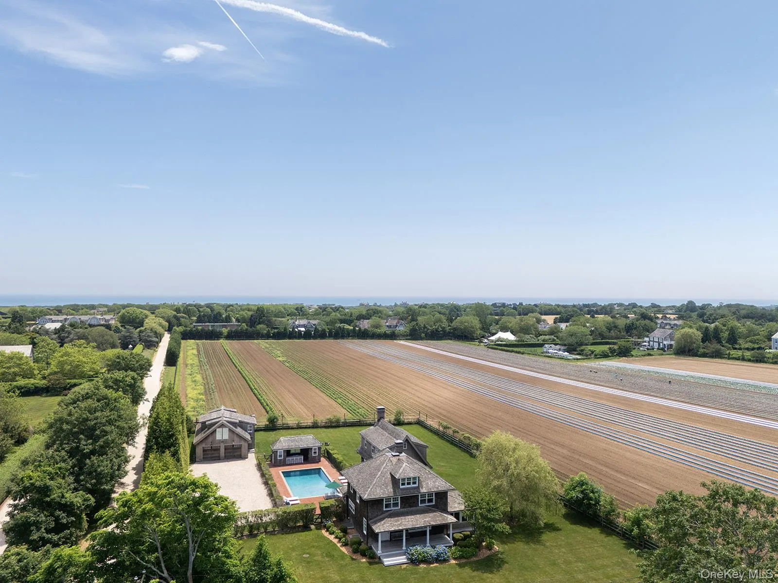 View of rural area with a pool and extensive farmland View of rural area with a pool and extensive farmland