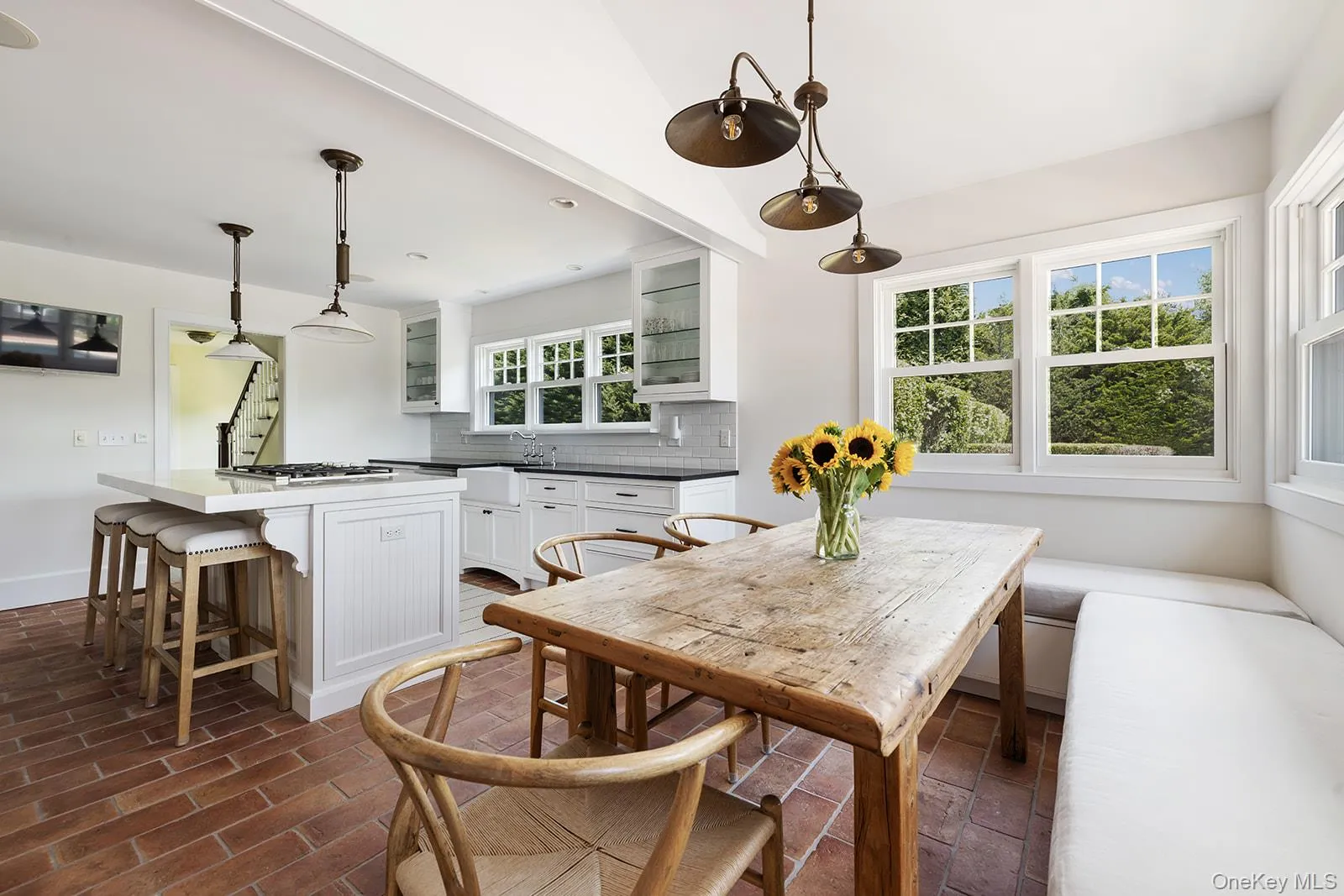 Dining area featuring brick floors and breakfast area Dining area featuring brick floors and breakfast area