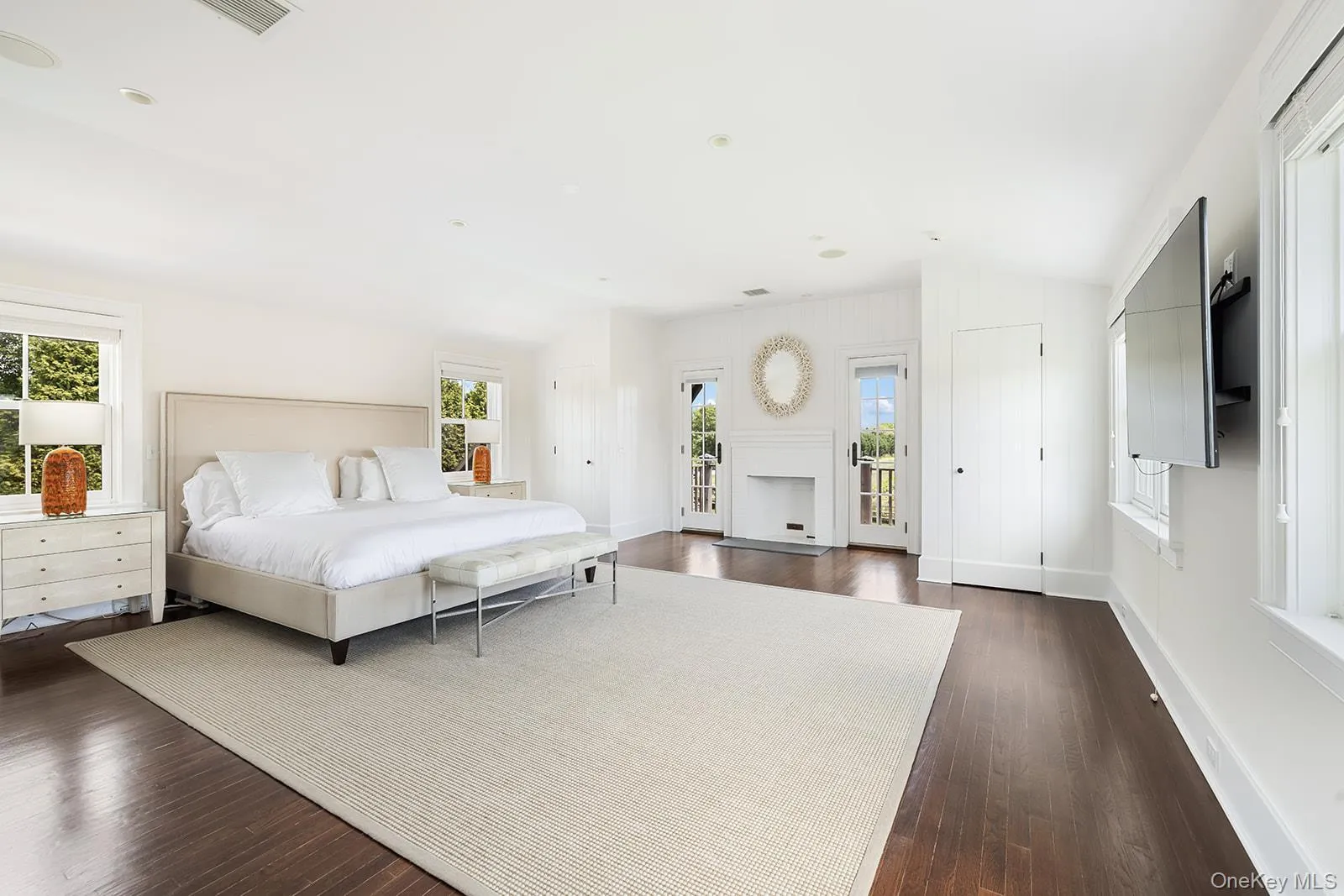 Bedroom with access to exterior, dark wood-type flooring, and vaulted ceiling Bedroom with access to exterior, dark wood-type flooring, and vaulted ceiling