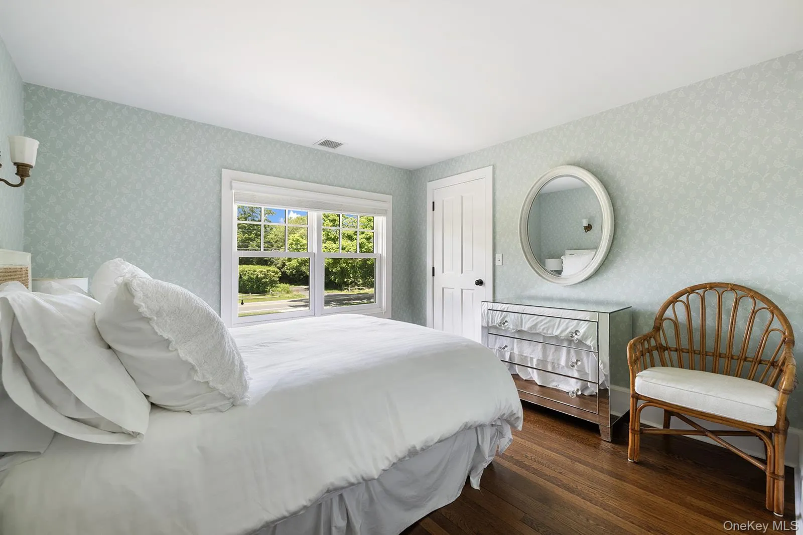 Bedroom featuring wood finished floors Bedroom featuring wood finished floors
