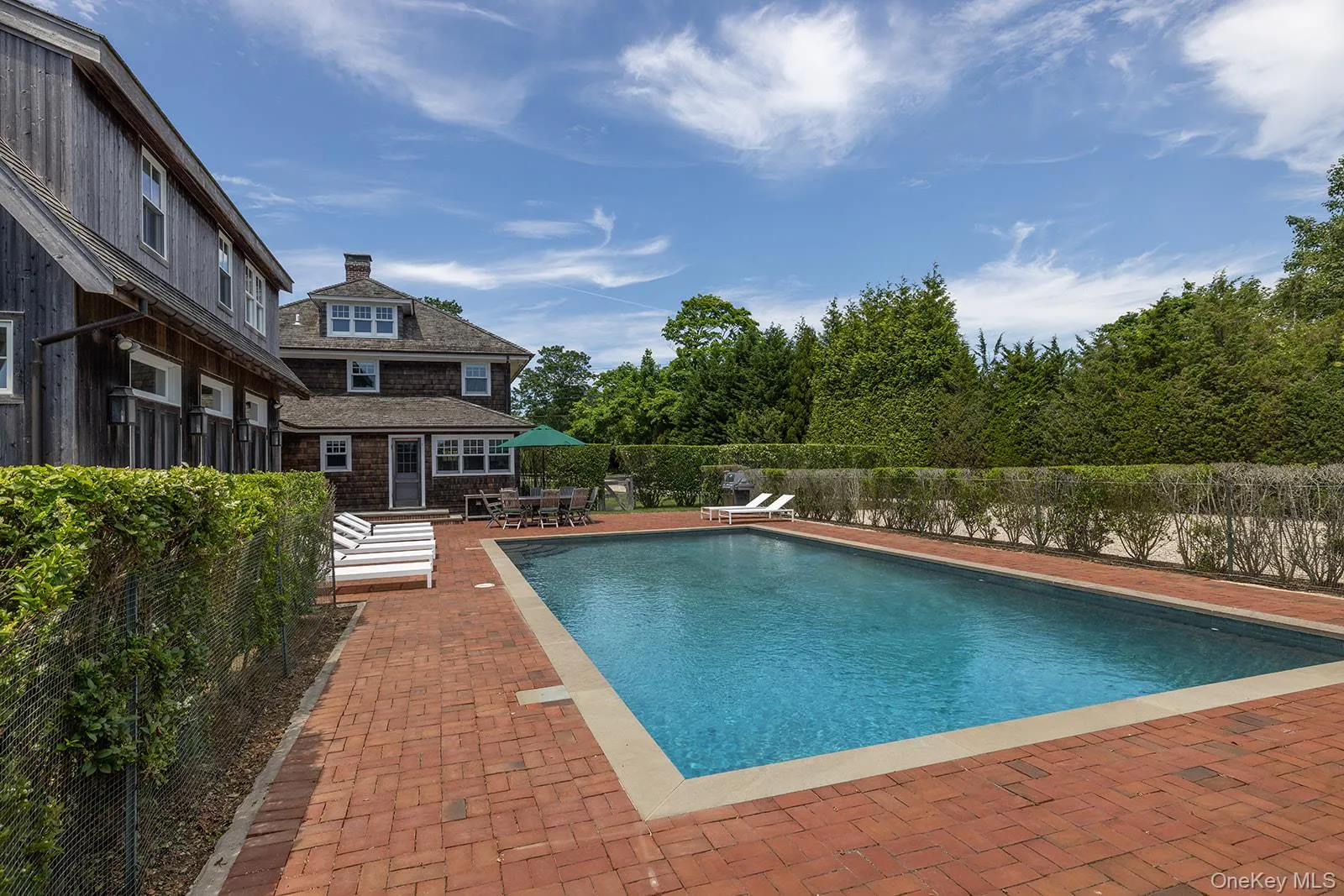 View of swimming pool featuring a patio area and a fenced backyard View of swimming pool featuring a patio area and a fenced backyard