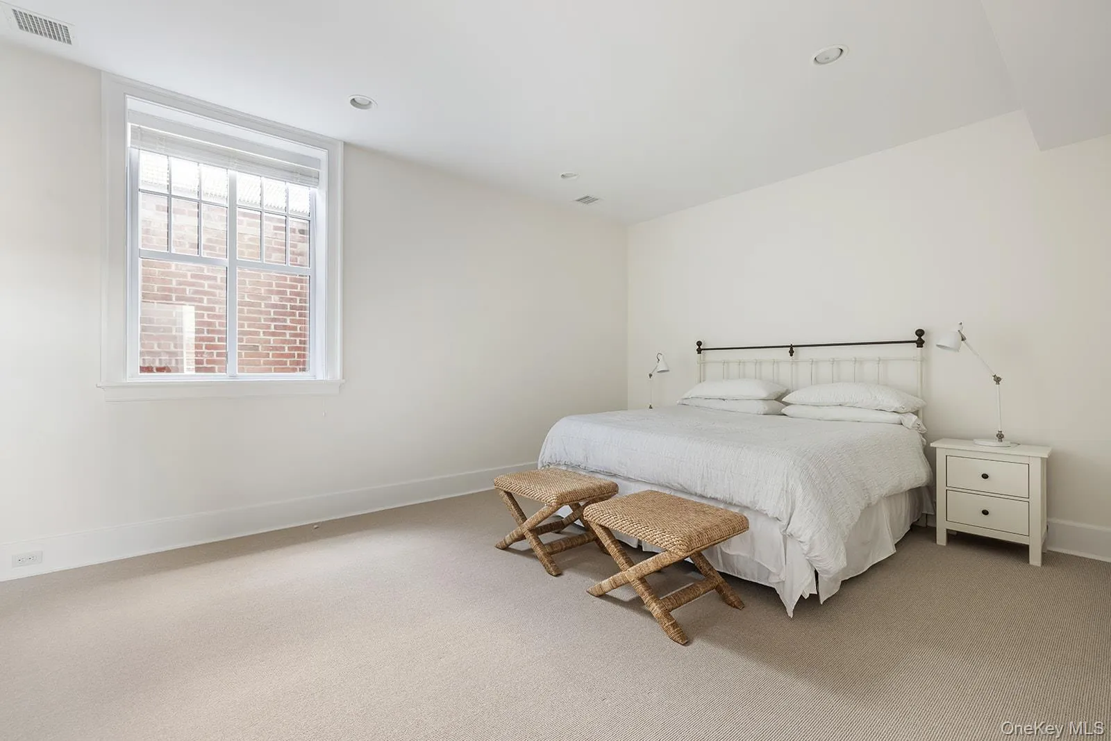 Carpeted bedroom featuring baseboards Carpeted bedroom featuring baseboards