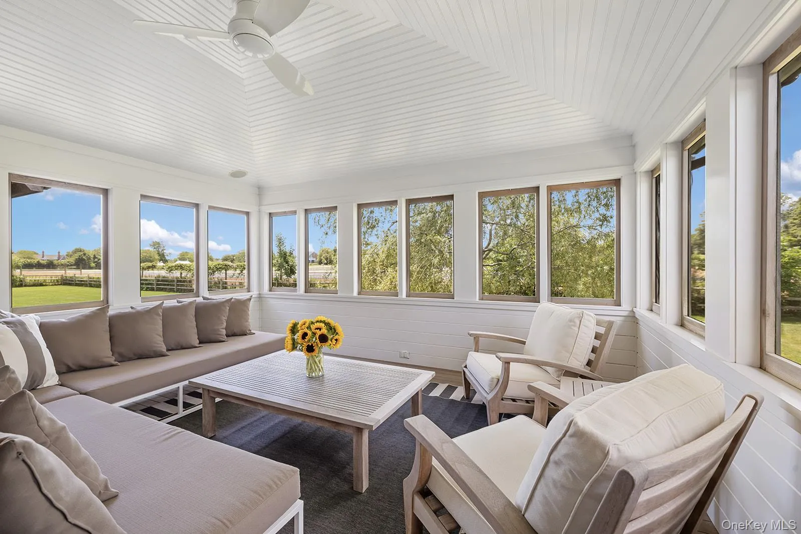 Sunroom featuring wooden ceiling Sunroom featuring wooden ceiling