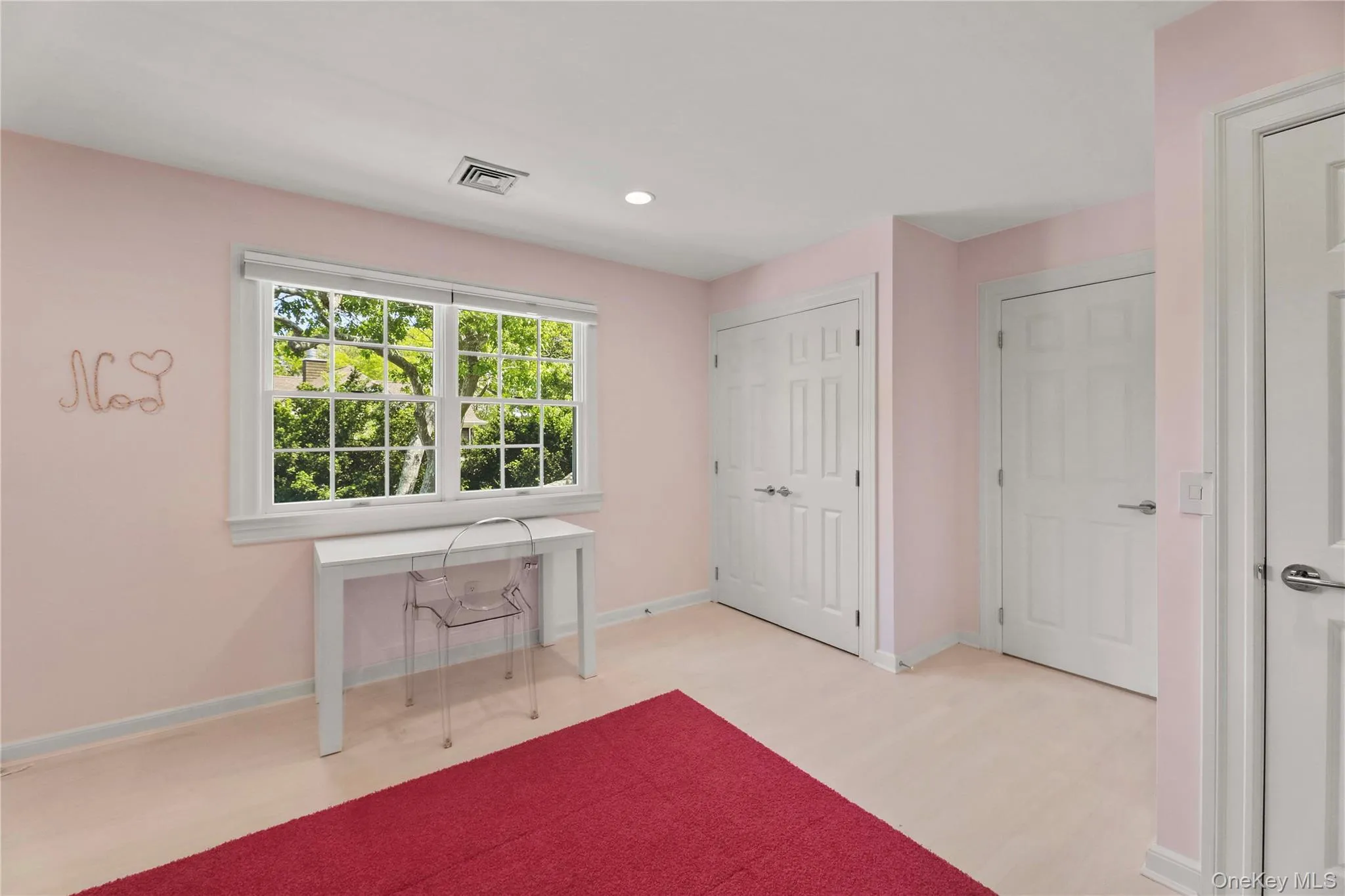 Bedroom with light wood-style flooring, baseboards, visible vents, and recessed lighting Bedroom with light wood-style flooring, baseboards, visible vents, and recessed lighting