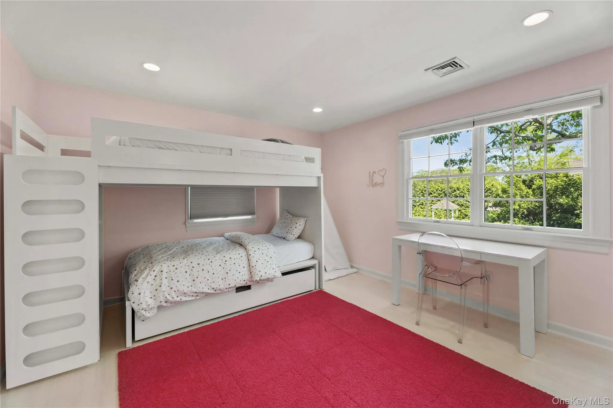 Bedroom featuring recessed lighting, visible vents, baseboards, and wood finished floors Bedroom featuring recessed lighting, visible vents, baseboards, and wood finished floors
