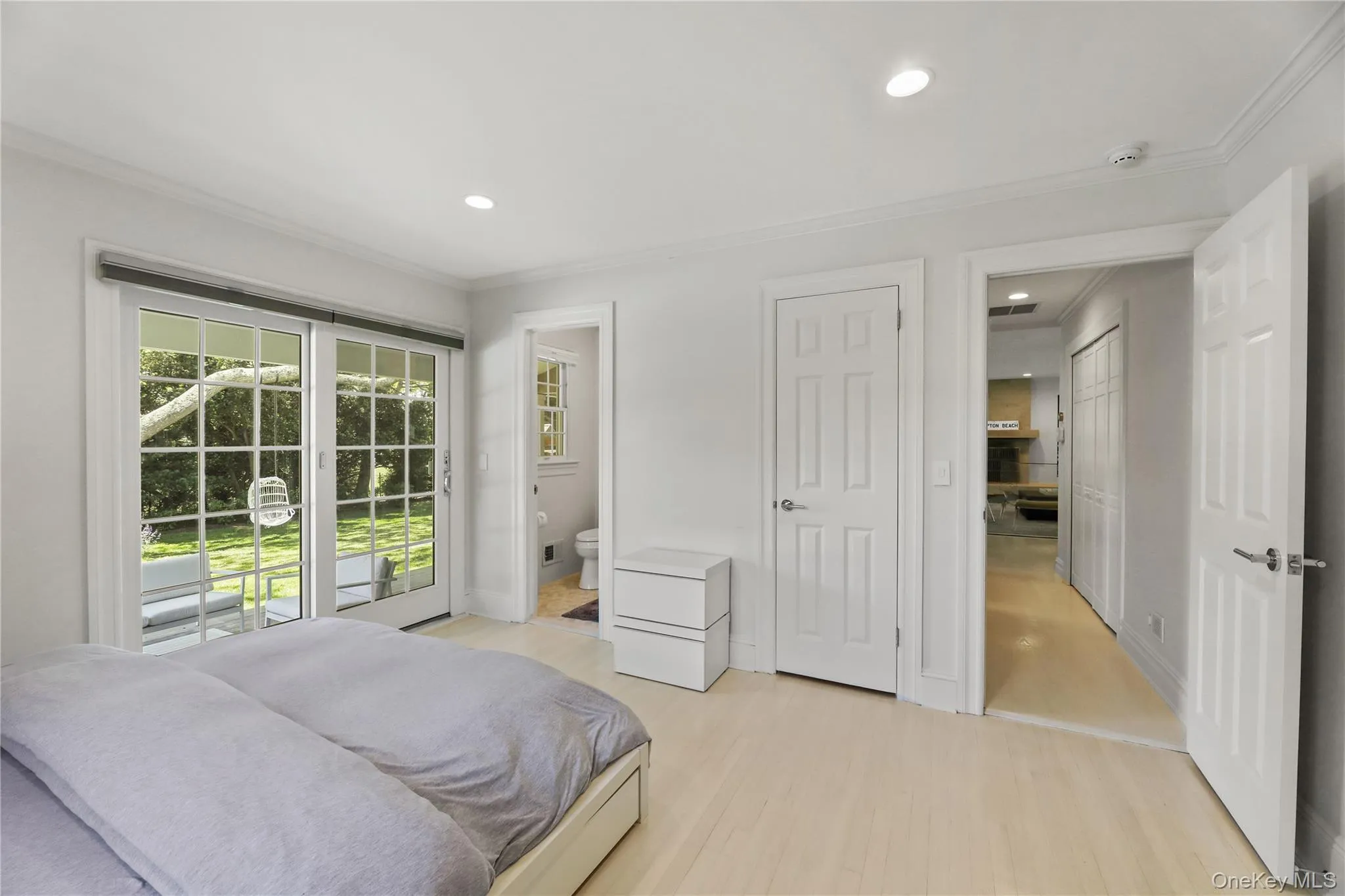 Bedroom with recessed lighting, light wood-type flooring, and ornamental molding Bedroom with recessed lighting, light wood-type flooring, and ornamental molding