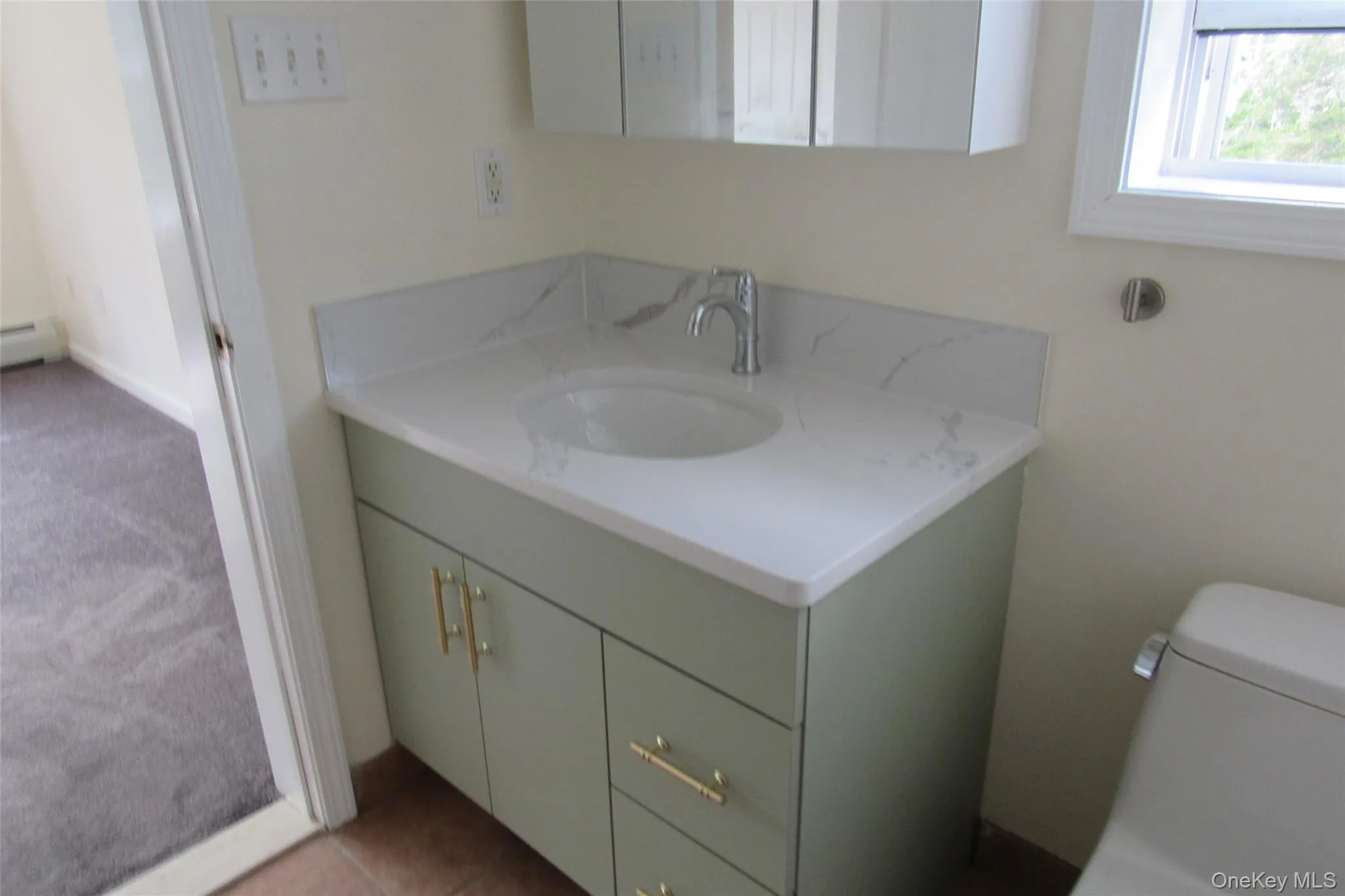 Full bath with vanity and light tile patterned floor Full bath with vanity and light tile patterned floor