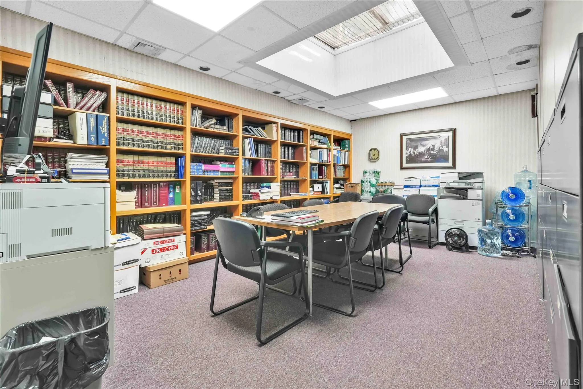 Home office featuring a drop ceiling and light colored carpet Home office featuring a drop ceiling and light colored carpet