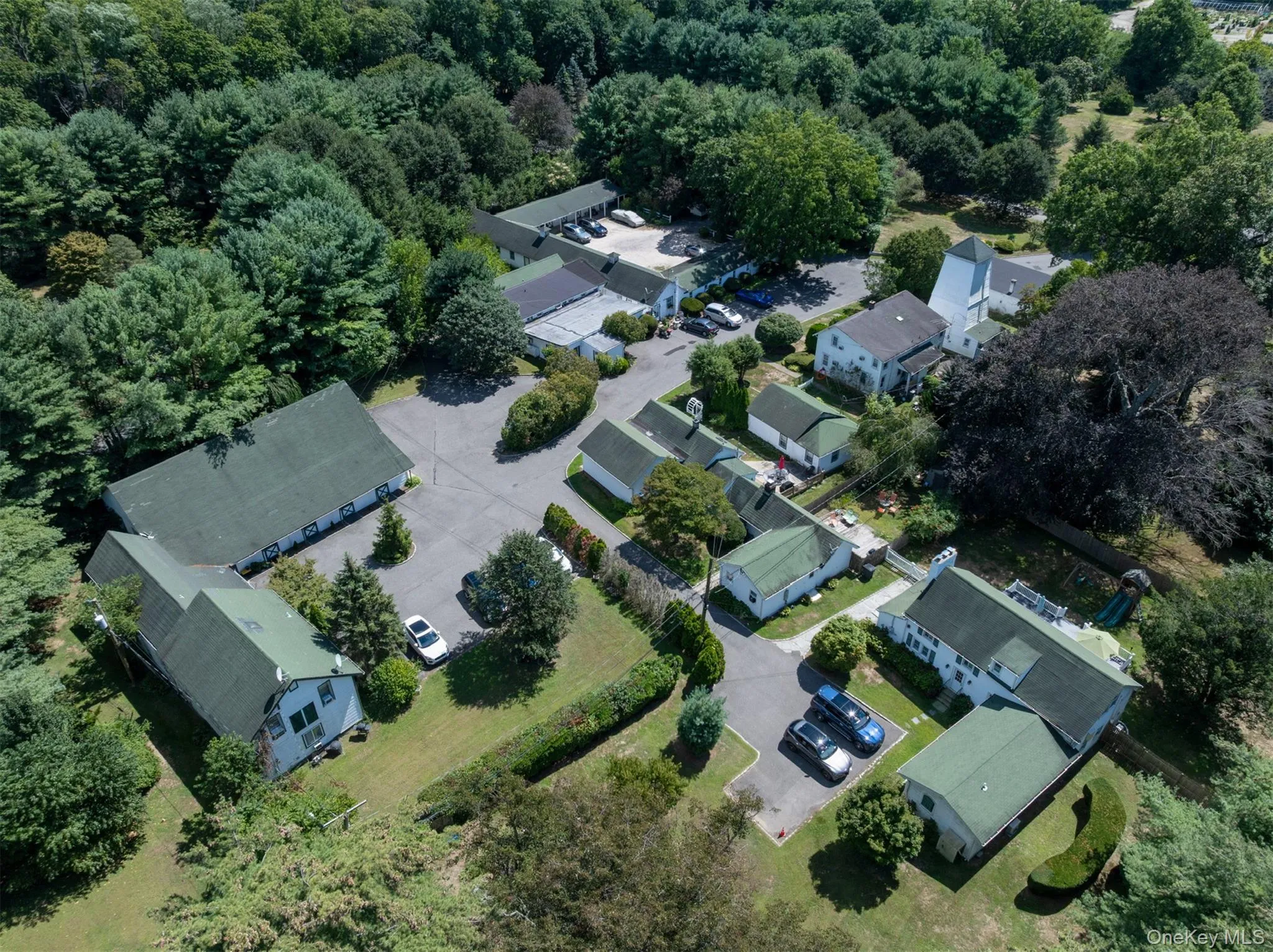 Aerial perspective of suburban area with a forest Aerial perspective of suburban area with a forest