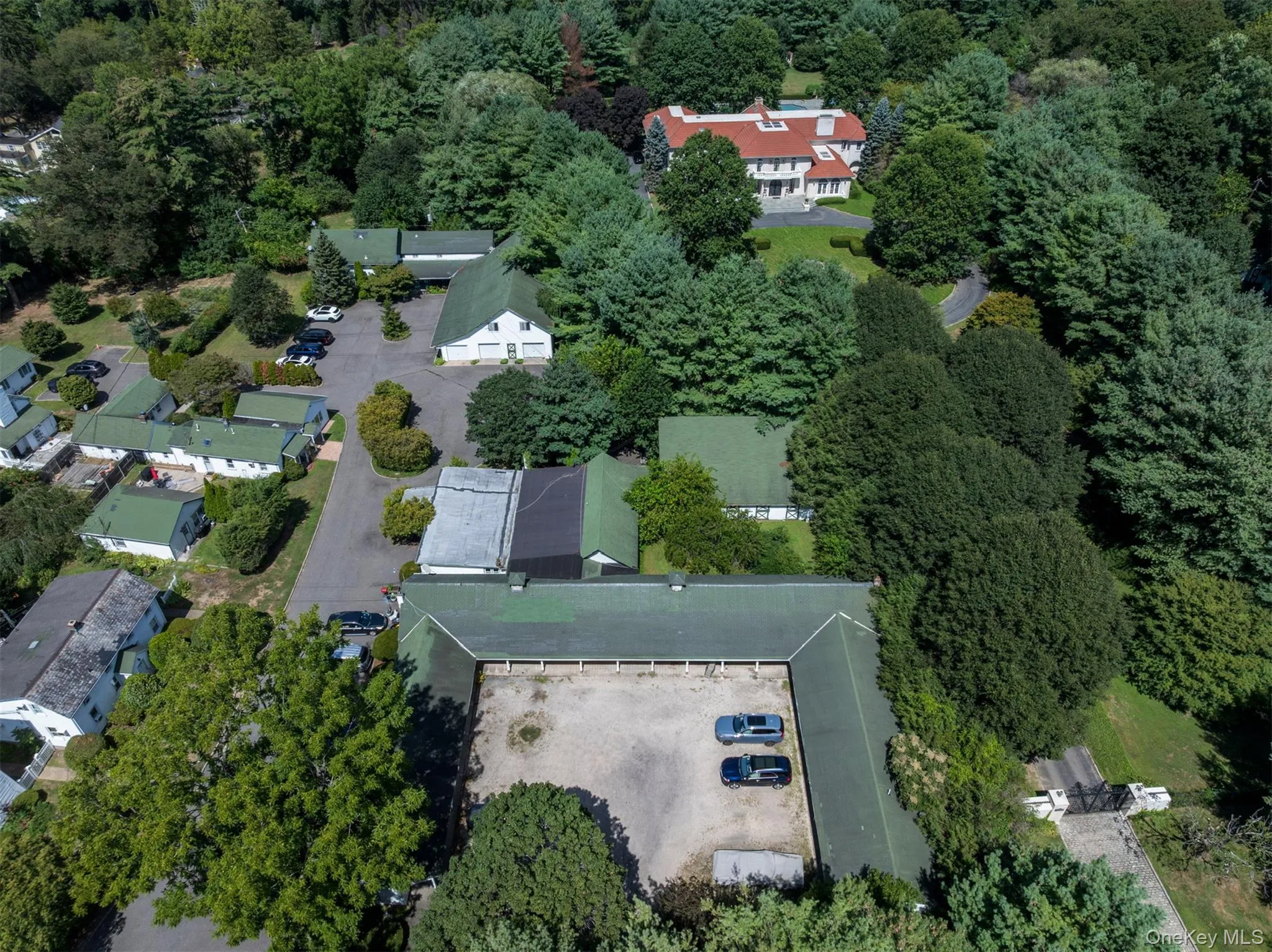 Aerial overview of property's location featuring a heavily wooded area Aerial overview of property's location featuring a heavily wooded area