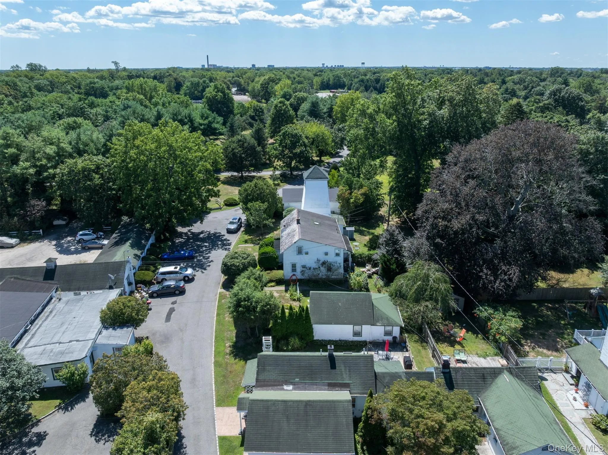 Aerial view of residential area featuring a heavily wooded area Aerial view of residential area featuring a heavily wooded area