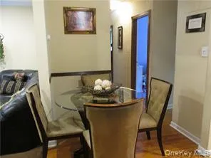 Dining area with wood finished floors and baseboards Dining area with wood finished floors and baseboards