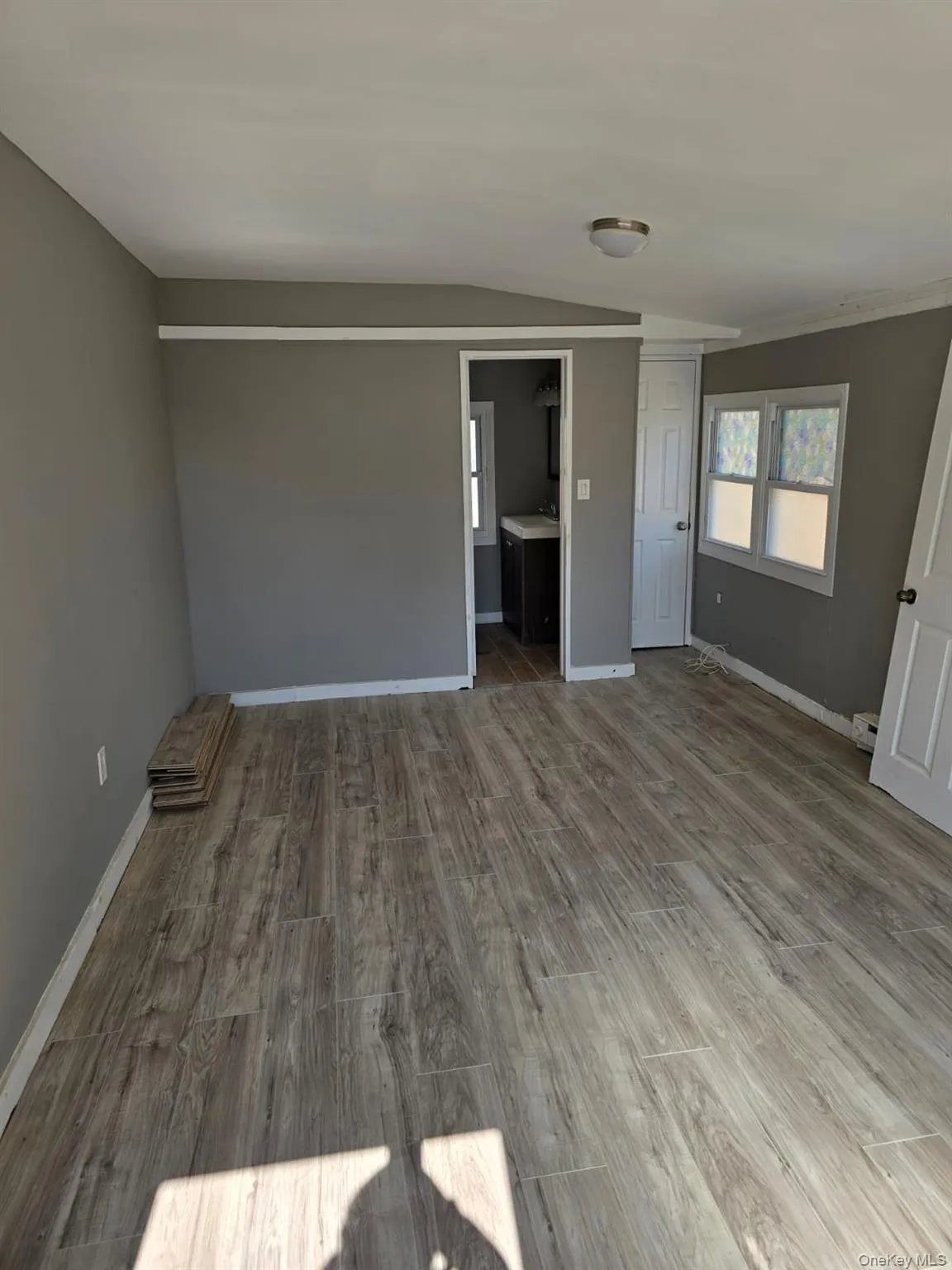 Unfurnished room featuring baseboards and wood finished floors Unfurnished room featuring baseboards and wood finished floors