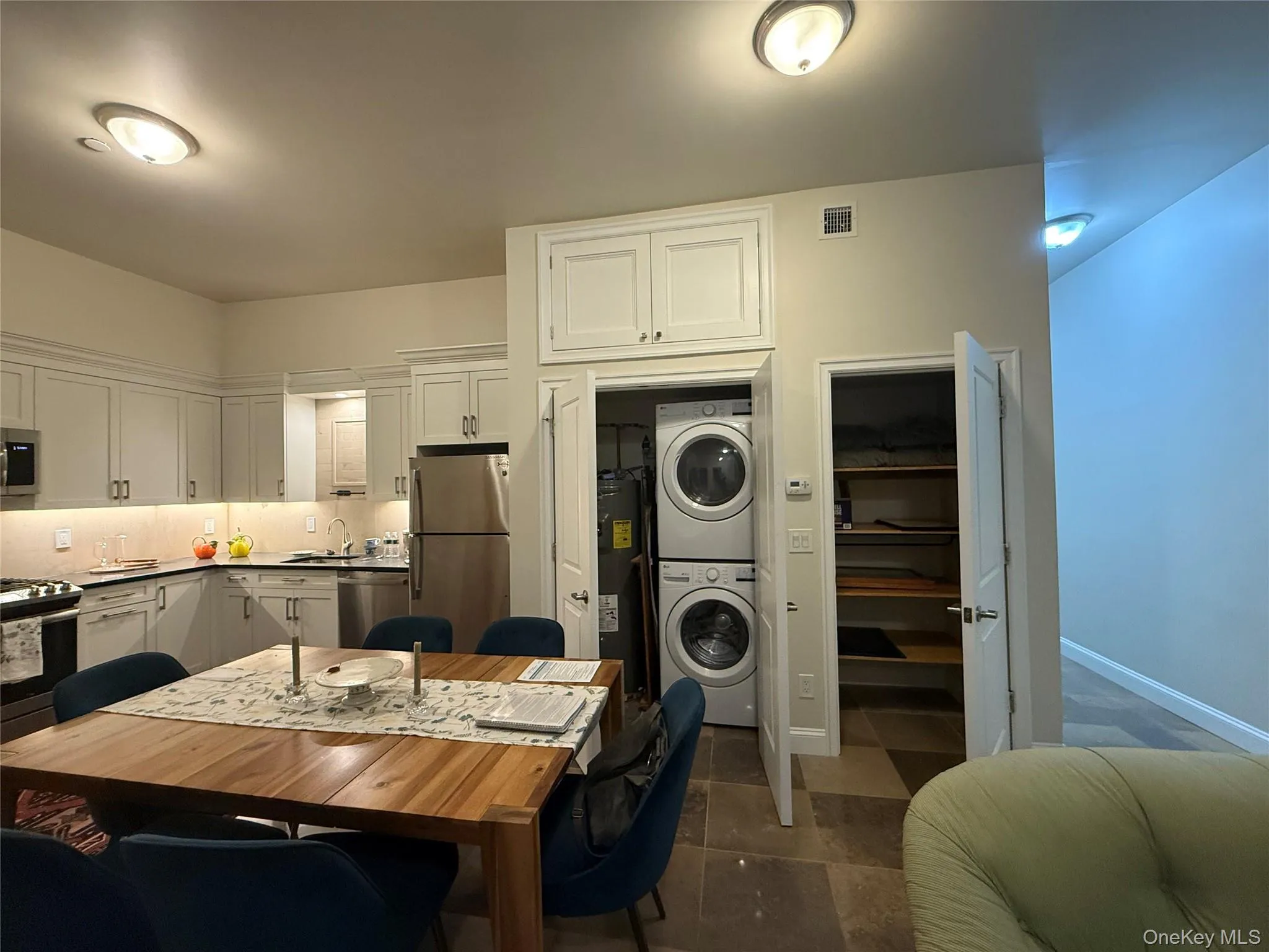 Full-size washer/dryer and hot water heater in closet in Living room, plus additional closet Full-size washer/dryer and hot water heater in closet in Living room, plus additional closet