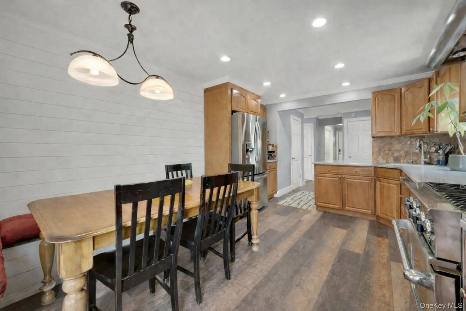 Kitchen peering into entry hall showing beautiful flooring Kitchen peering into entry hall showing beautiful flooring