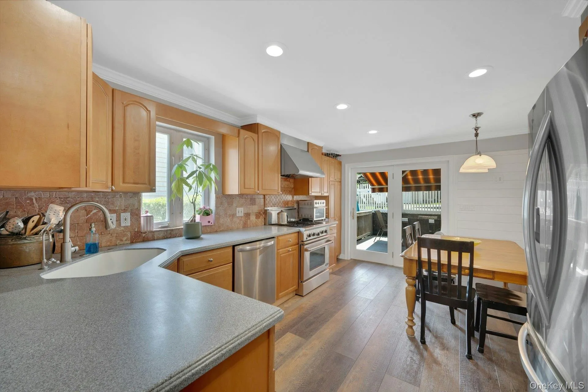 Large eat in kitchen showing the Corian counter tops and recessed lighting Large eat in kitchen showing the Corian counter tops and recessed lighting