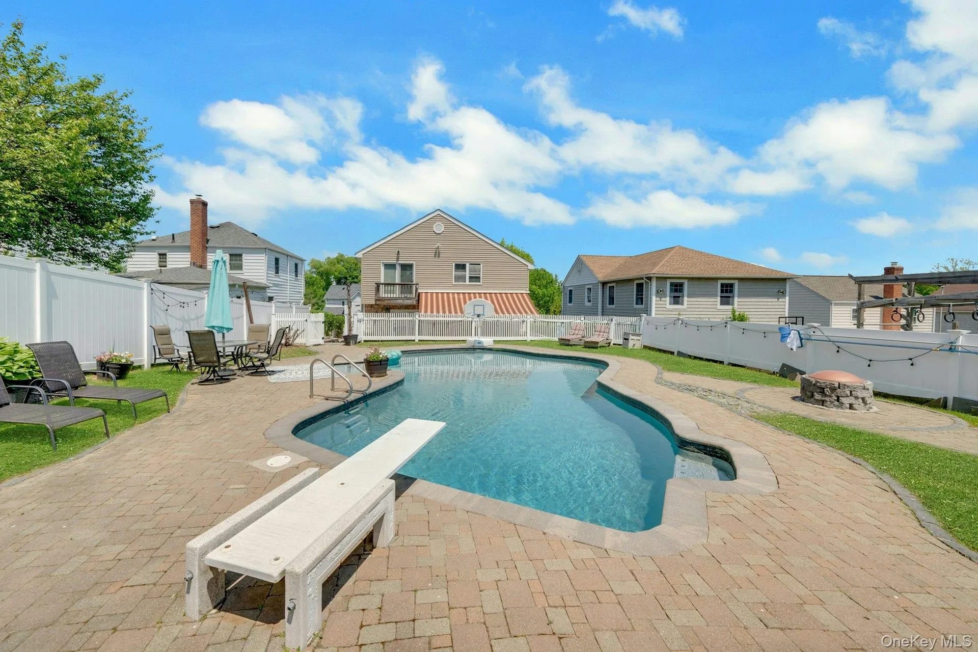 Another view of the pool and its beautiful yard Another view of the pool and its beautiful yard