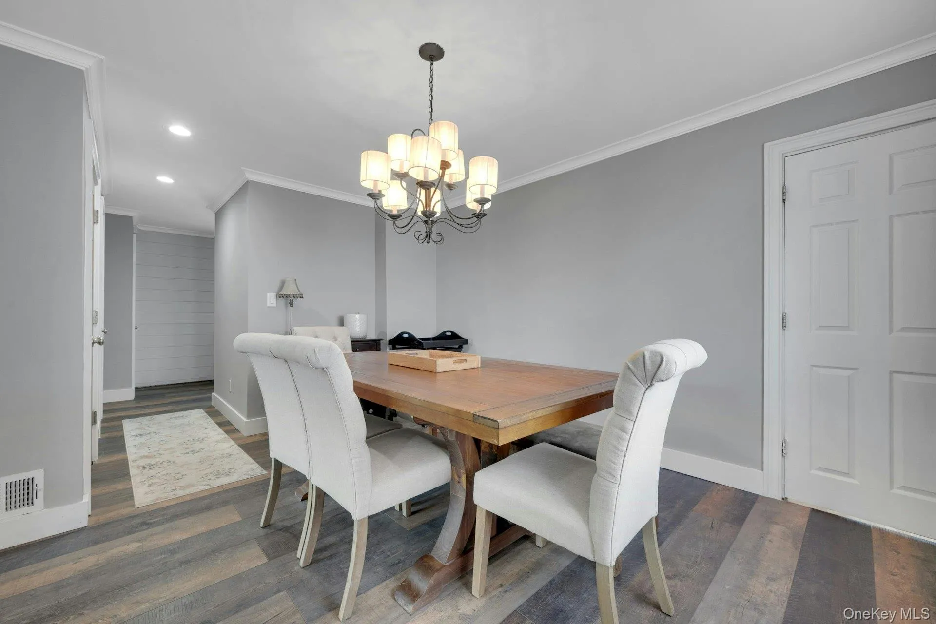 Dining room located off of the living room and hall with its beautiful flooring Dining room located off of the living room and hall with its beautiful flooring