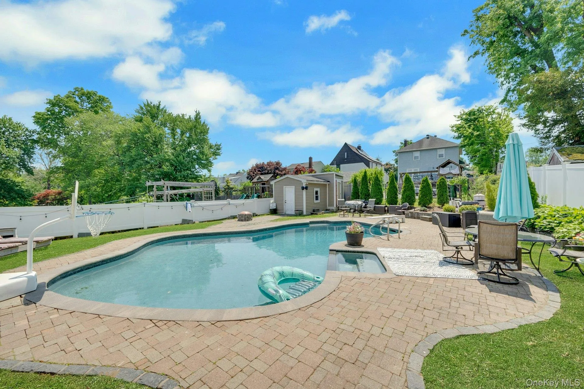 A view of a close up of the pool and the surrounding brick pavers A view of a close up of the pool and the surrounding brick pavers