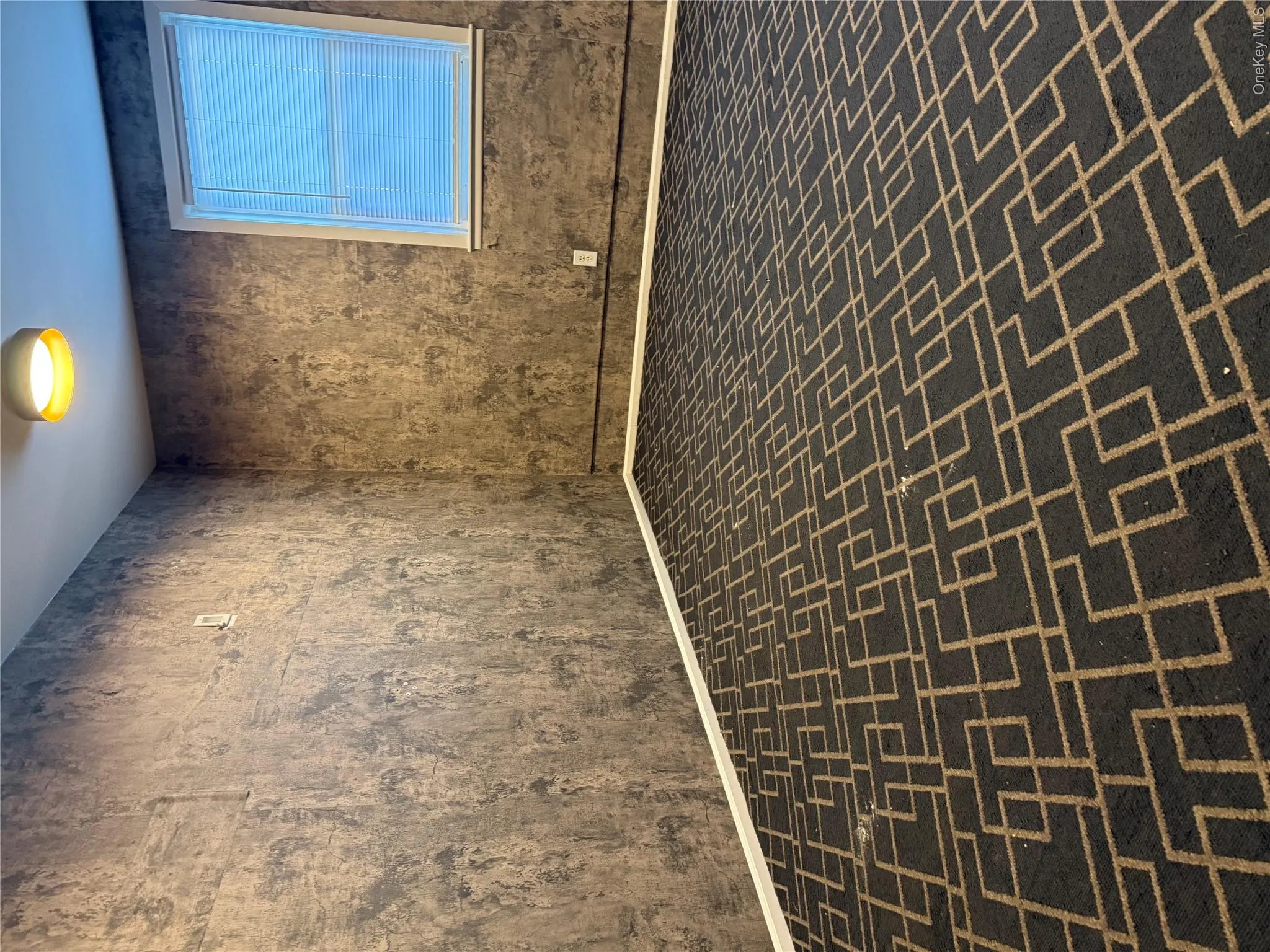 Empty room featuring brick floors and baseboards Empty room featuring brick floors and baseboards