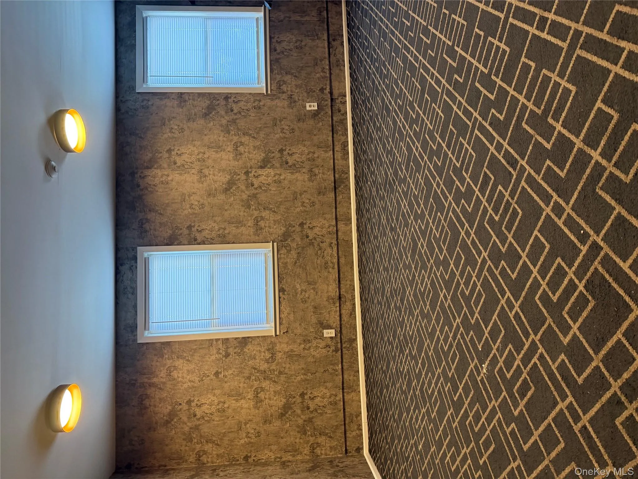 Spare room featuring brick patterned floors and baseboards Spare room featuring brick patterned floors and baseboards